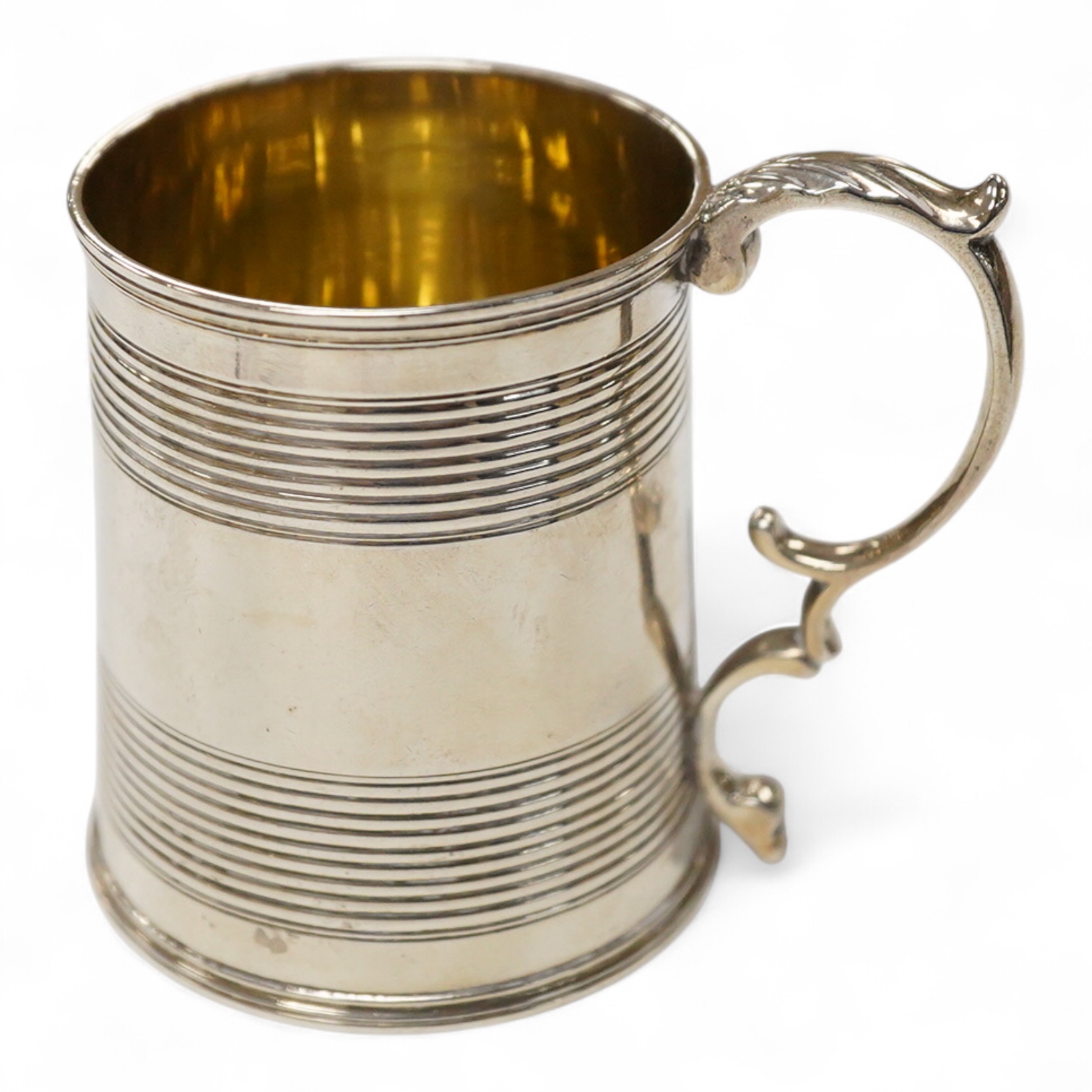 A William IV reeded silver christening mug, with later engraved initials and date to the base, Joseph Angell I & John Angell I, London, 1834, height 77mm, 3.9oz.